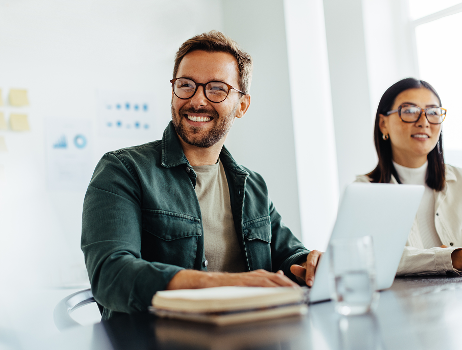 Man smiling at computer